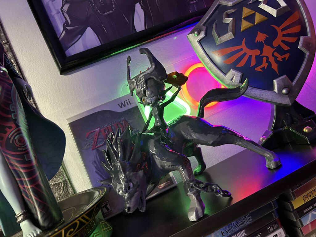 Wolf Link and Midna figure next to Twilight Princess Wii game